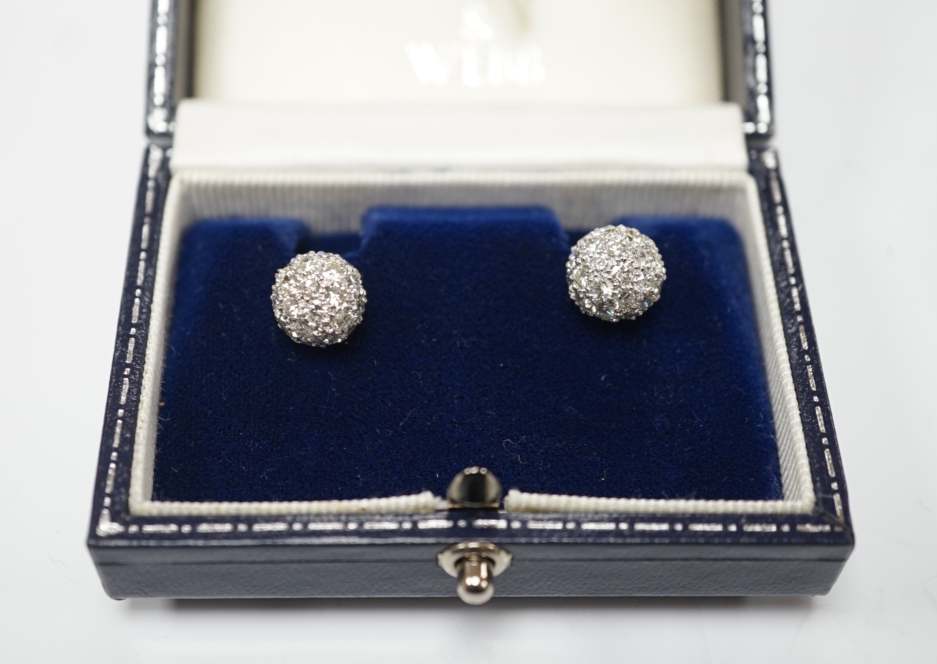A modern pair of 18k white metal and pave set diamond spherical earrings, 9mm, gross 6.2 grams.